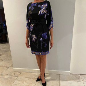 Elie Tahari black dress with floral print and black belt.